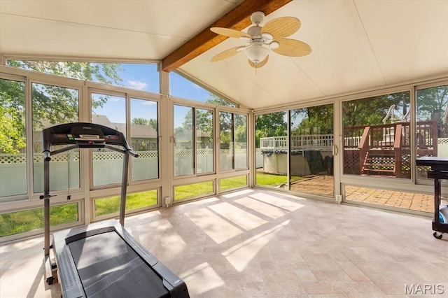 unfurnished sunroom featuring ceiling fan