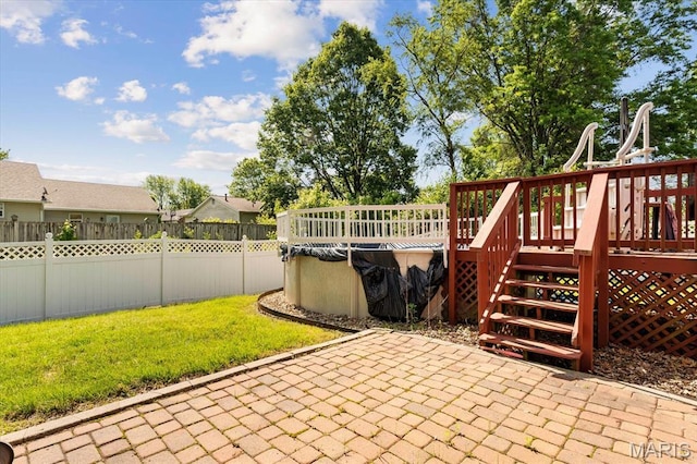 view of patio featuring a deck and stairway