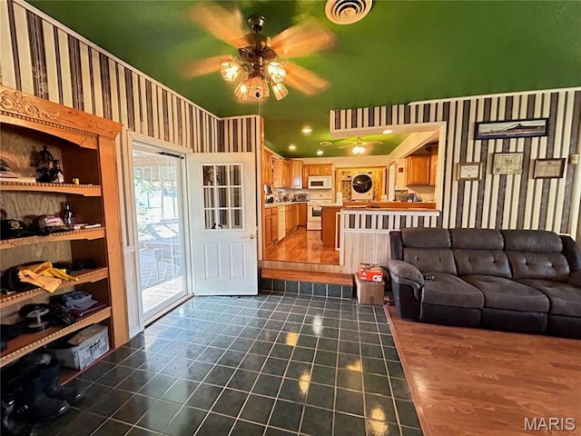 120 E Beth St, Licking, MO 65542 - living area featuring a ceiling fan and dark tile patterned flooring