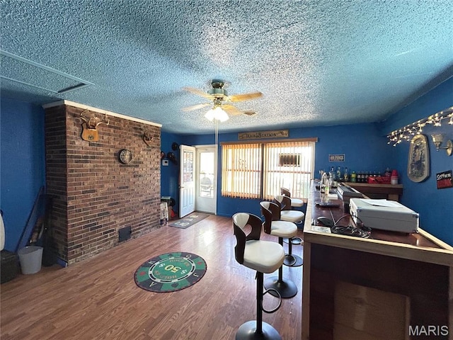 120 E Beth St, Licking, MO 65542 - dining room with a textured ceiling, wood finished floors, and a ceiling fan