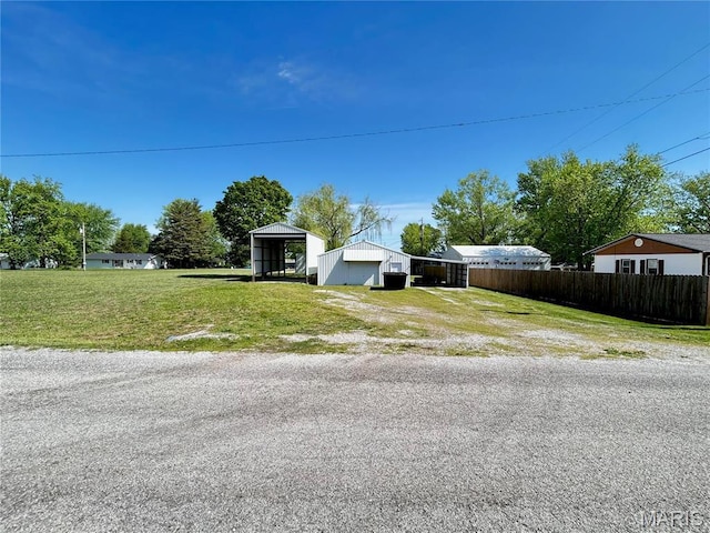 120 E Beth St, Licking, MO 65542 - view of front of home with a garage, driveway, and an outdoor structure