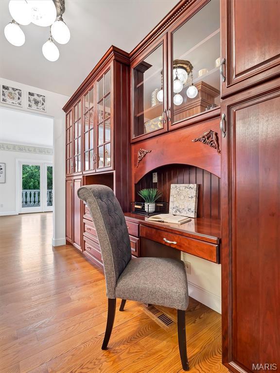 590 Fairway Dr, Union, MO 63084 - office featuring light wood finished floors, built in desk, and baseboards