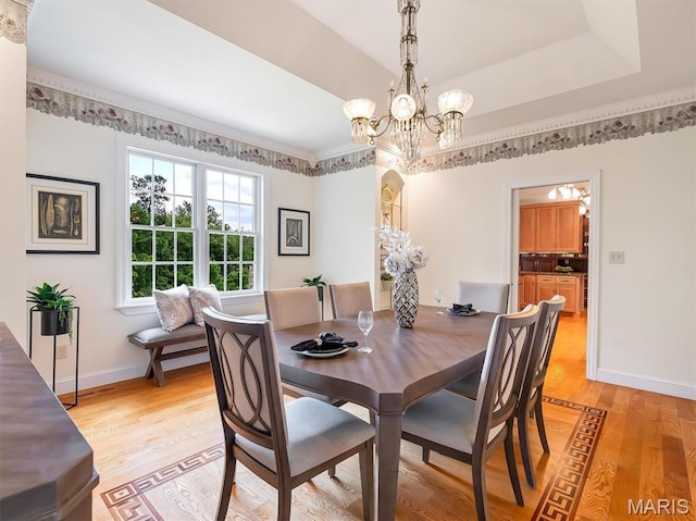 590 Fairway Dr, Union, MO 63084 - dining room with a chandelier, light wood-style flooring, and baseboards