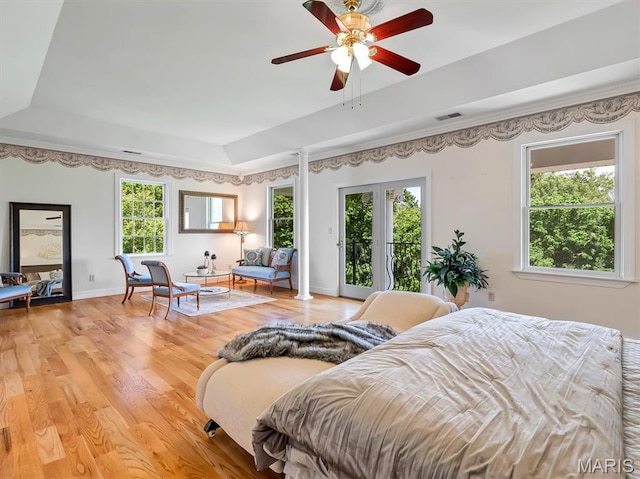 590 Fairway Dr, Union, MO 63084 - bedroom with a raised ceiling, access to outside, light wood-style flooring, and baseboards