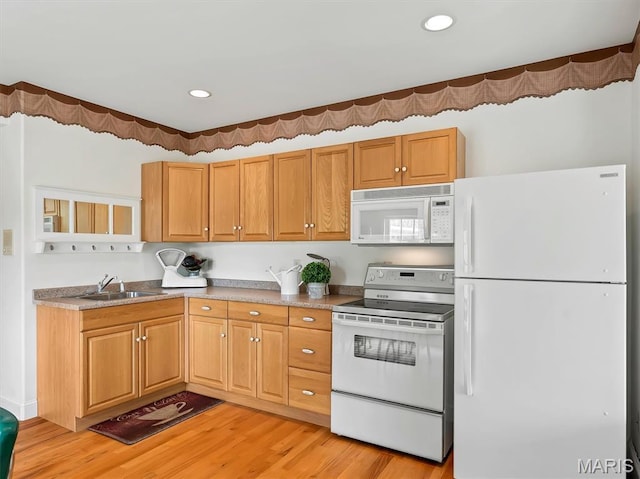 590 Fairway Dr, Union, MO 63084 - kitchen with white appliances, a sink, light wood finished floors, and recessed lighting