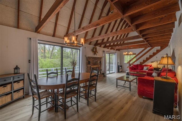 87 E Altdorf Dr, Innsbrook, MO 63390 - dining space featuring a chandelier, wood finished floors, high vaulted ceiling, and beam ceiling