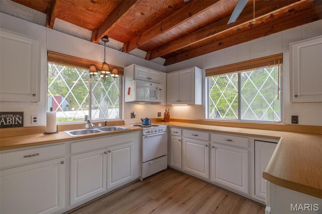 87 E Altdorf Dr, Innsbrook, MO 63390 - kitchen featuring white appliances, a sink, light wood-style floors, healthy amount of natural light, and wooden ceiling with exposed beams