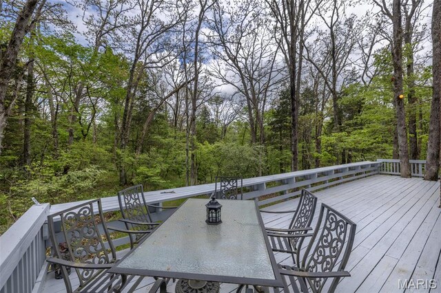 87 E Altdorf Dr, Innsbrook, MO 63390 - deck featuring outdoor dining area and a view of trees