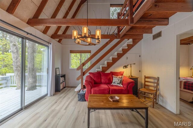 87 E Altdorf Dr, Innsbrook, MO 63390 - living area with light wood-type flooring, stairway, and a chandelier
