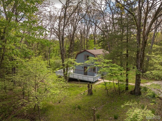 87 E Altdorf Dr, Innsbrook, MO 63390 - view of yard with a wooden deck and a wooded view