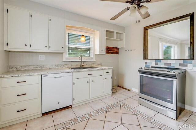 kitchen with white dishwasher, stainless steel range with electric stovetop, a sink, backsplash, and white cabinets
