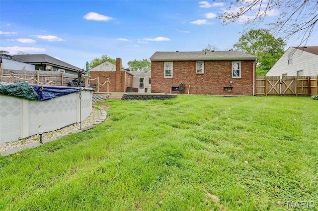rear view of property featuring brick siding