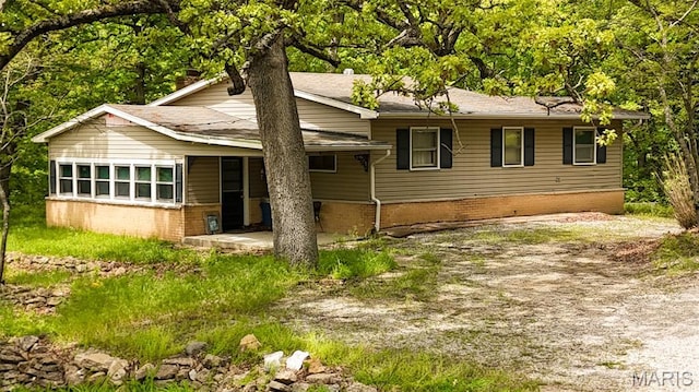 15222 Circle Dr, Gillespie, IL 62033 - view of front of house featuring brick siding, a patio, and a shingled roof