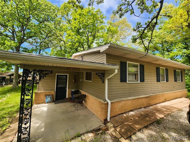 15222 Circle Dr, Gillespie, IL 62033 - view of front of property with brick siding and a patio