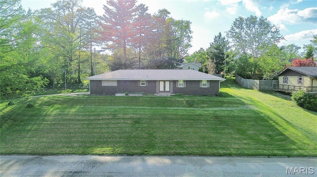 4900 Eiffel Dr, Godfrey, IL 62035 - back of property with dirt driveway and a lawn