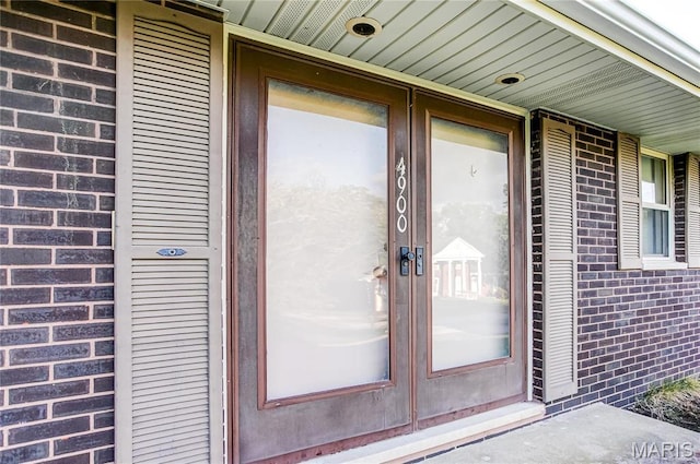 4900 Eiffel Dr, Godfrey, IL 62035 - property entrance featuring brick siding and french doors