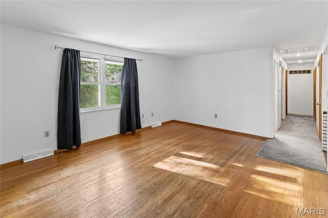 4900 Eiffel Dr, Godfrey, IL 62035 - unfurnished room with wood finished floors and baseboards