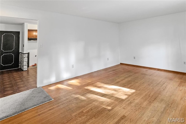 4900 Eiffel Dr, Godfrey, IL 62035 - unfurnished room with wood finished floors and baseboards