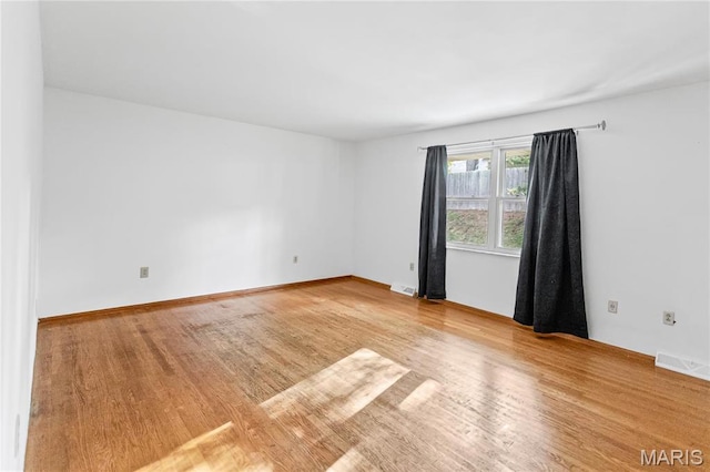 4900 Eiffel Dr, Godfrey, IL 62035 - unfurnished room with wood finished floors and baseboards