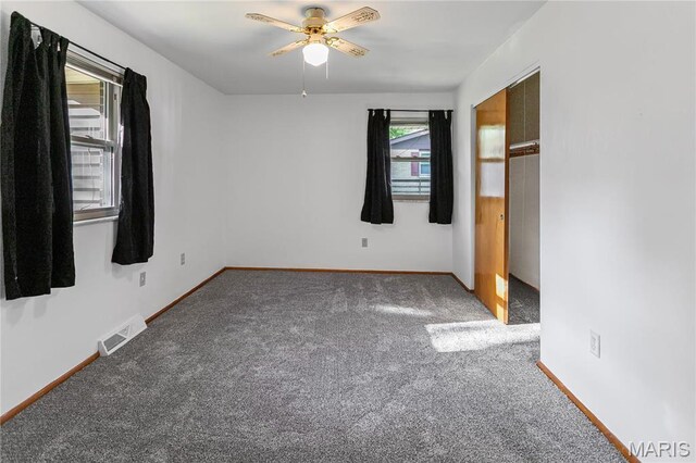 4900 Eiffel Dr, Godfrey, IL 62035 - unfurnished bedroom featuring carpet, baseboards, and a ceiling fan