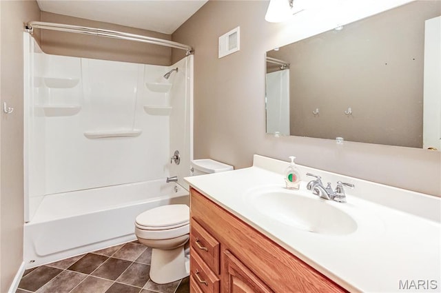 4900 Eiffel Dr, Godfrey, IL 62035 - bathroom featuring toilet, tile patterned floors, vanity, and shower / tub combination