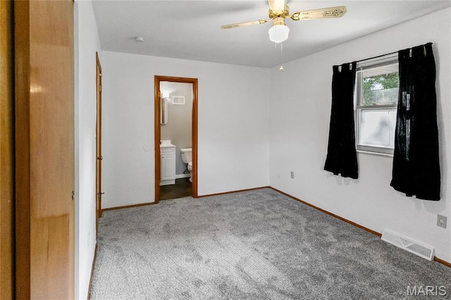 4900 Eiffel Dr, Godfrey, IL 62035 - unfurnished bedroom featuring carpet flooring, baseboards, ensuite bathroom, and a ceiling fan