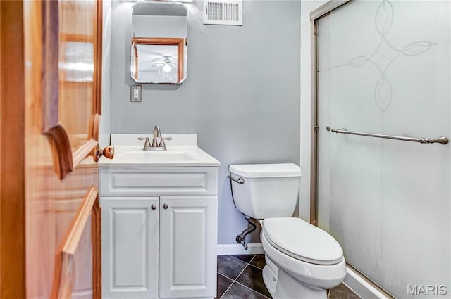 4900 Eiffel Dr, Godfrey, IL 62035 - full bath with toilet, a stall shower, vanity, tile patterned flooring, and baseboards