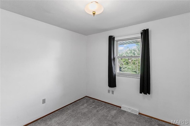 4900 Eiffel Dr, Godfrey, IL 62035 - unfurnished room featuring baseboards and carpet flooring
