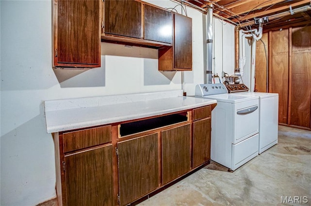 4900 Eiffel Dr, Godfrey, IL 62035 - laundry room with independent washer and dryer and cabinet space