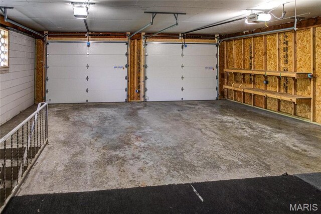 4900 Eiffel Dr, Godfrey, IL 62035 - garage featuring a garage door opener