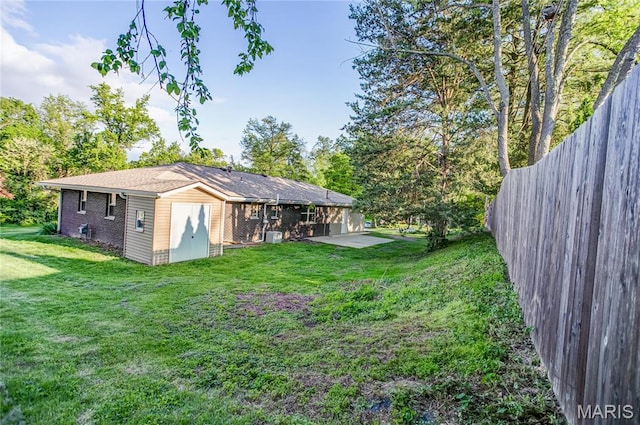 4900 Eiffel Dr, Godfrey, IL 62035 - back of house with a patio area and brick siding