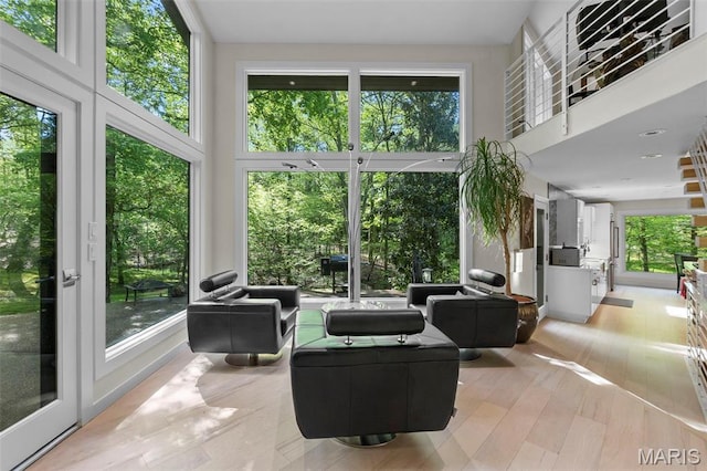 sunroom / solarium featuring plenty of natural light