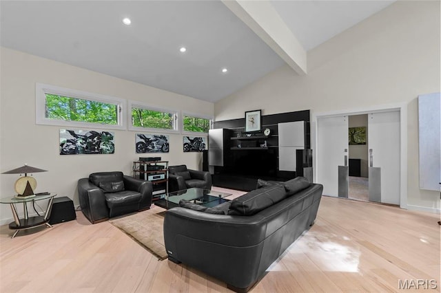 living area featuring wood finished floors, beam ceiling, high vaulted ceiling, and recessed lighting