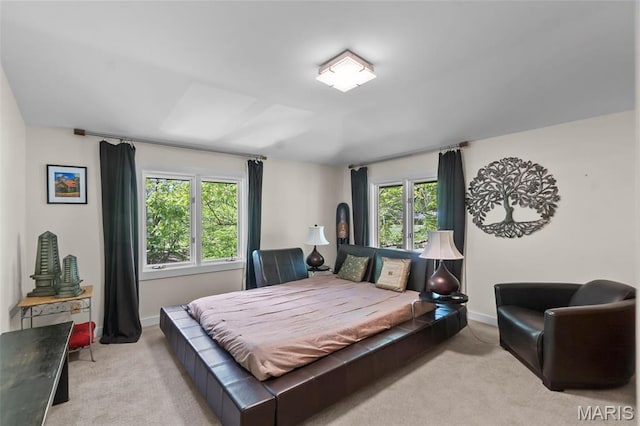 carpeted bedroom with baseboards