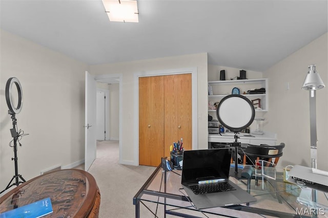 office featuring light carpet and baseboards