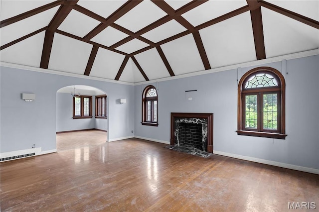 7280 S Roland Blvd, Saint Louis, MO 63121 - unfurnished living room featuring a high end fireplace, baseboards, high vaulted ceiling, wood finished floors, and beamed ceiling
