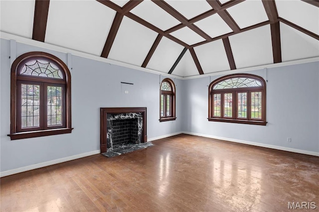 7280 S Roland Blvd, Saint Louis, MO 63121 - unfurnished living room featuring high vaulted ceiling, baseboards, wood finished floors, a fireplace, and beam ceiling