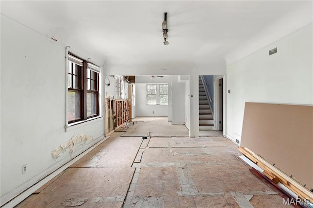 7280 S Roland Blvd, Saint Louis, MO 63121 - spare room with stairway and a ceiling fan