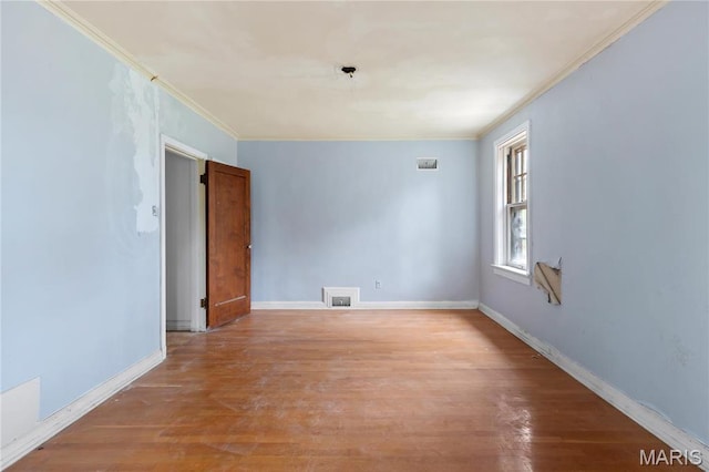 7280 S Roland Blvd, Saint Louis, MO 63121 - empty room featuring ornamental molding, light wood-type flooring, and baseboards
