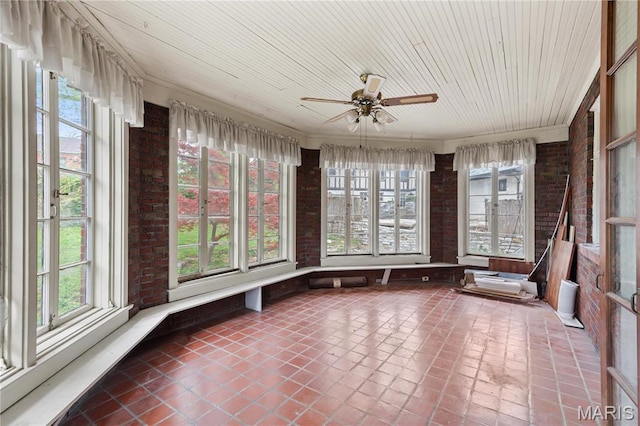 7280 S Roland Blvd, Saint Louis, MO 63121 - unfurnished sunroom with brick wall, tile patterned flooring, and wood ceiling