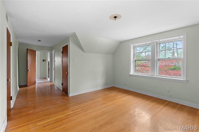 7280 S Roland Blvd, Saint Louis, MO 63121 - bonus room featuring light wood-style floors, baseboards, and lofted ceiling