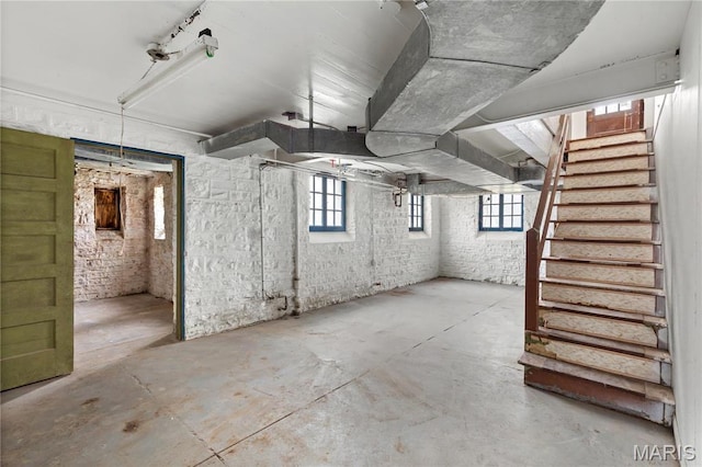 7280 S Roland Blvd, Saint Louis, MO 63121 - basement featuring stairs and healthy amount of natural light