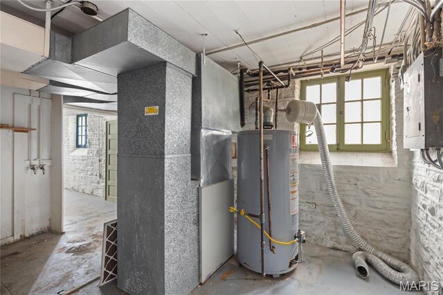 7280 S Roland Blvd, Saint Louis, MO 63121 - utility room featuring gas water heater, heating unit, and electric panel