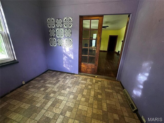 1323 Union Ave, Belleville, IL 62220 - spare room with baseboards, brick patterned flooring, and ceiling fan