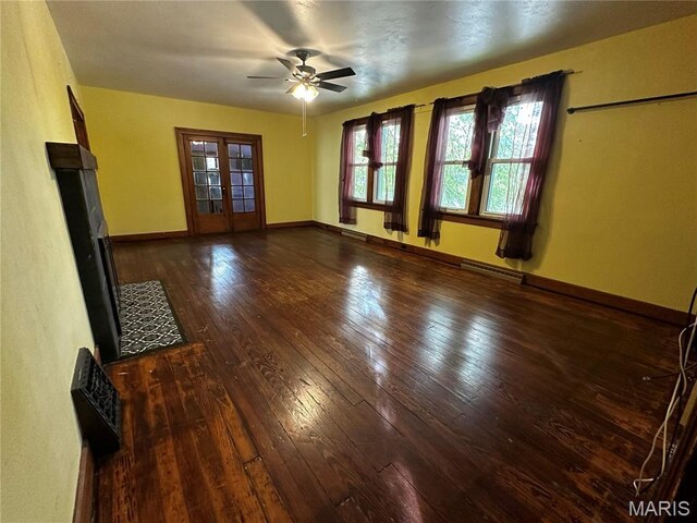 1323 Union Ave, Belleville, IL 62220 - unfurnished living room featuring ceiling fan, hardwood / wood-style floors, and baseboards