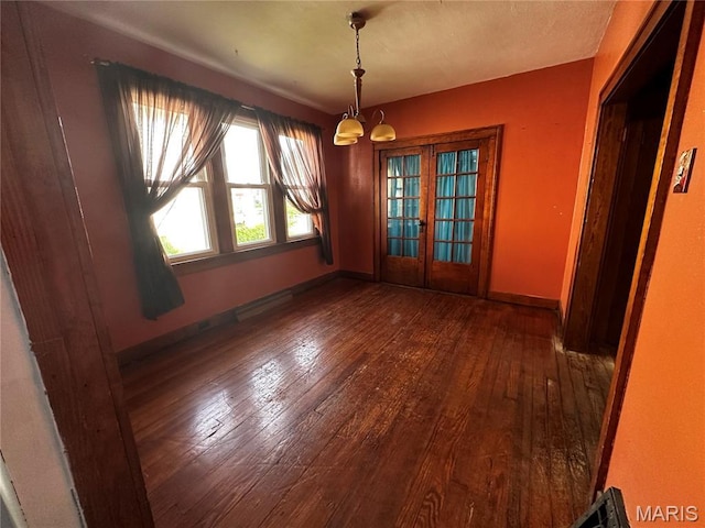 1323 Union Ave, Belleville, IL 62220 - unfurnished dining area featuring hardwood / wood-style floors, a chandelier, french doors, and baseboards