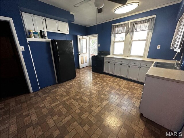 1323 Union Ave, Belleville, IL 62220 - kitchen featuring black appliances, a sink, ceiling fan, light countertops, and healthy amount of natural light
