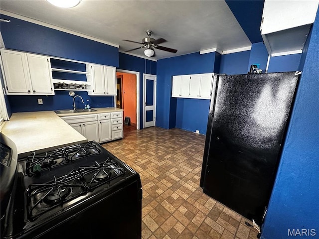 1323 Union Ave, Belleville, IL 62220 - kitchen with a sink, black appliances, brick patterned flooring, a ceiling fan, and white cabinets