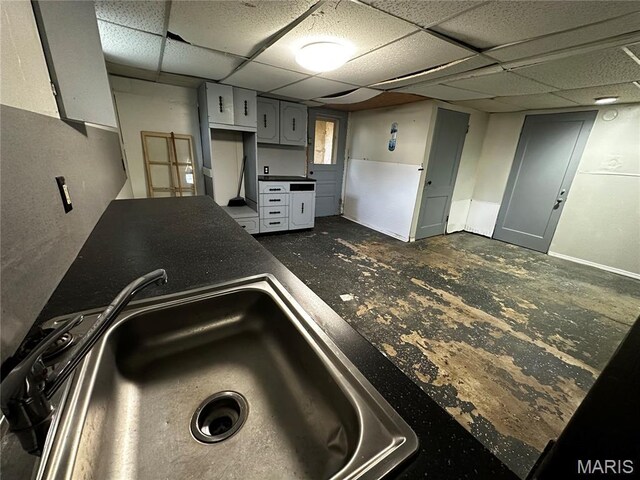 1323 Union Ave, Belleville, IL 62220 - kitchen featuring a sink, dark countertops, and a paneled ceiling