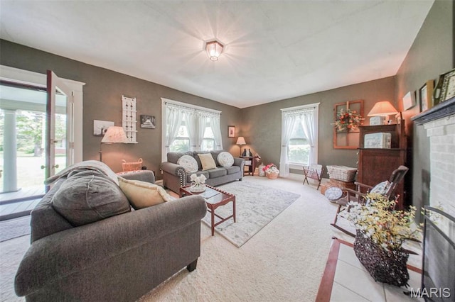 carpeted living area featuring a fireplace